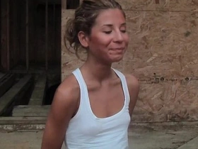 A petite woman flaunts her breasts and buttocks for financial gain