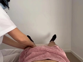 Masseuse surprises a naked man with an erotic massage, leading to a handjob and climax