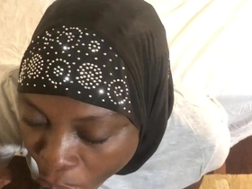 Dark-skinned mother with big breasts in hijab receives facial from young black man